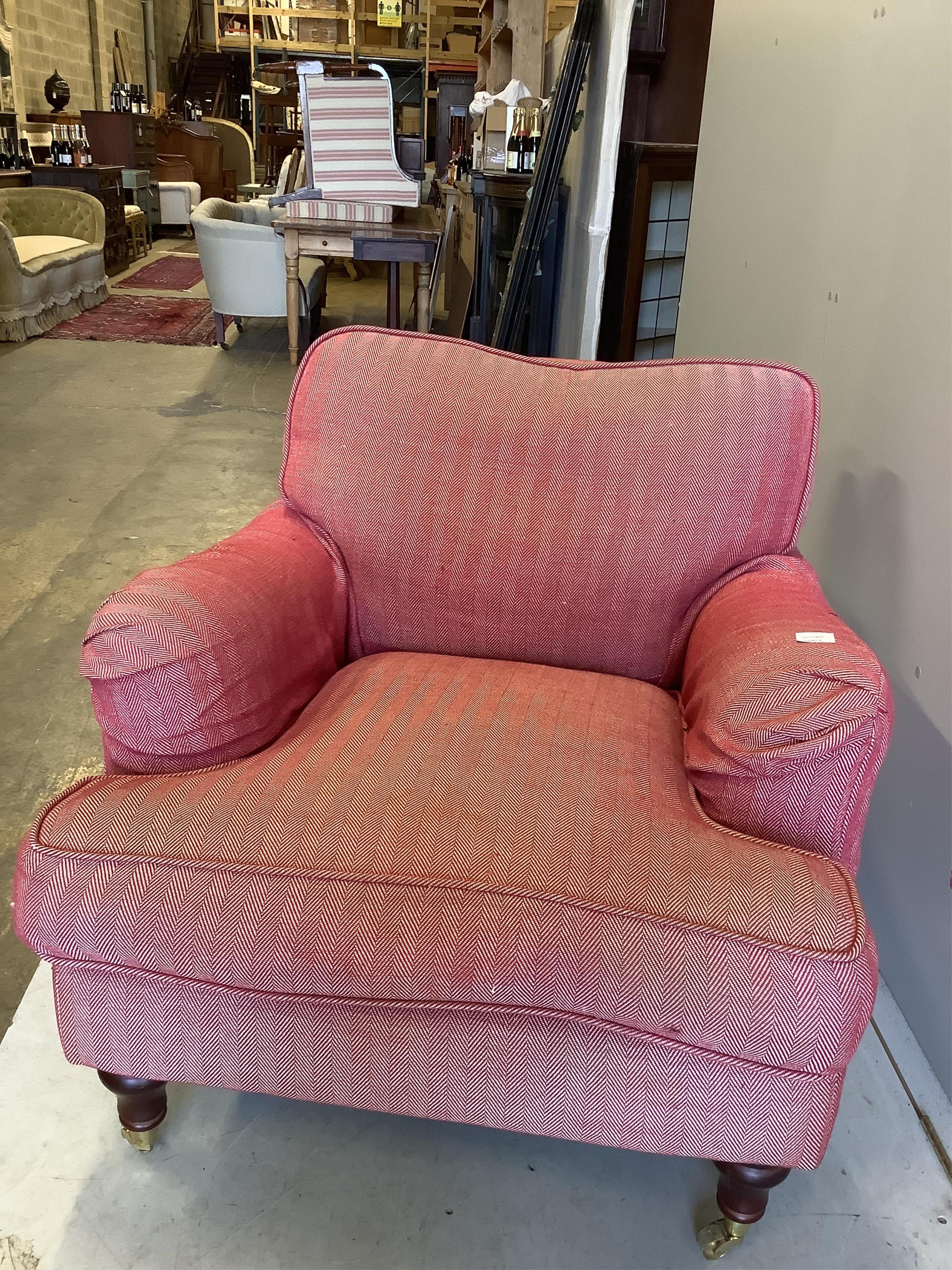 A modern Howard style upholstered armchair, width 90cm, depth 100cm, height 75cm. Condition - fair